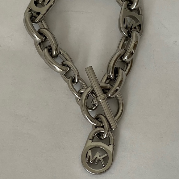 Michael Kors Polished Silver Tone MK Logo-Lock Bracelet. - Picture 2 of 6